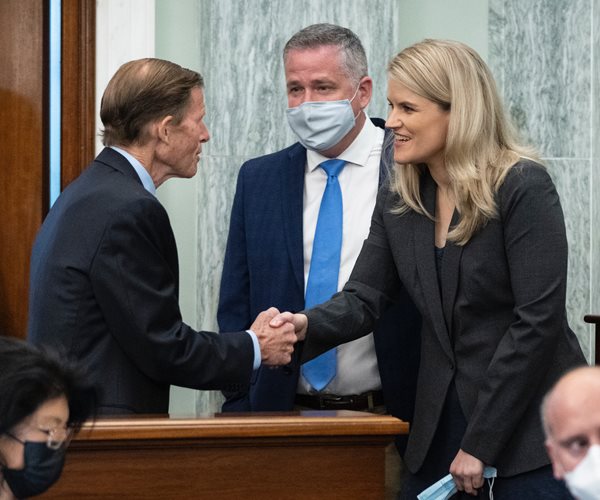 senator richard blumenthal shakes hands with facebook whistleblower