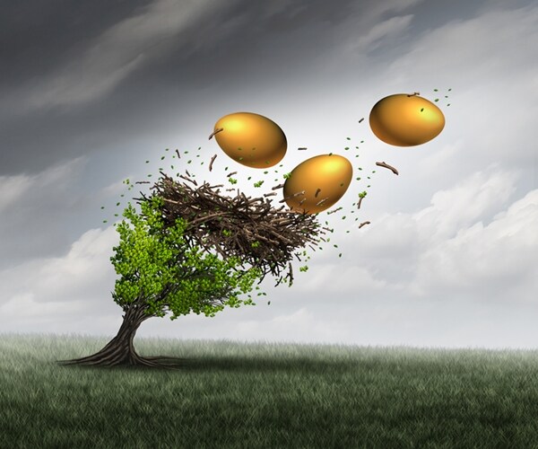  tree in peril with a nest and gold eggs falling out during a destructive thunder storm