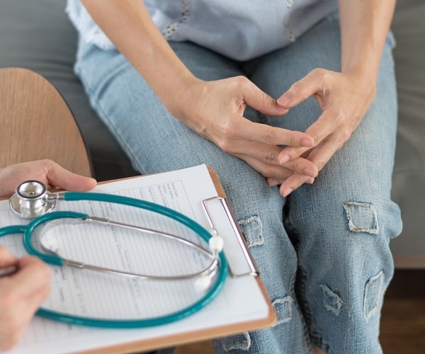 woman talking to doctor about cervical cancer screening