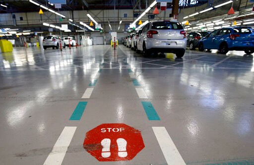 Peugeot-Citroen Seeks Job Cuts Prompted by Macron Reforms