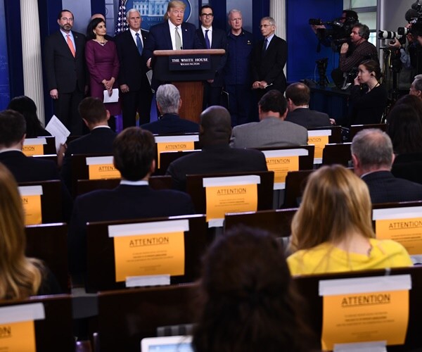 the press sit every other chair at a briefing at the white house