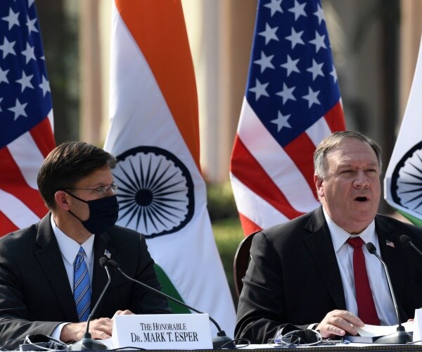 pompeo and esper speaking with us and indian flags in the background