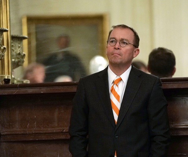 chief of staff mick mulvaney listens to president speaking