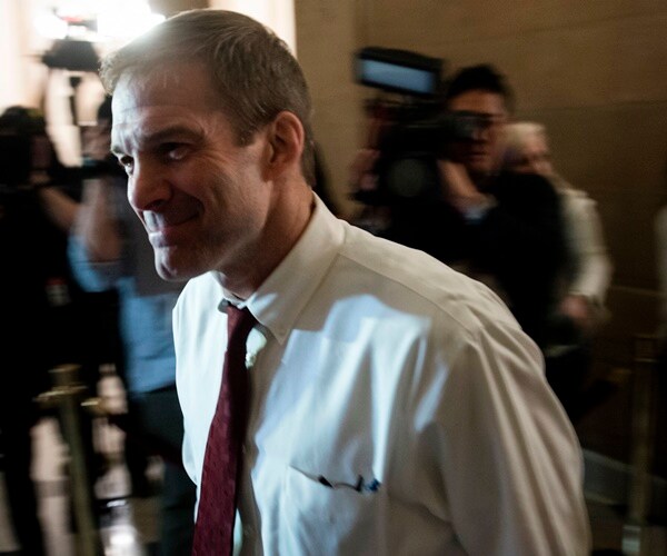 jim jordan walks through the halls of congress