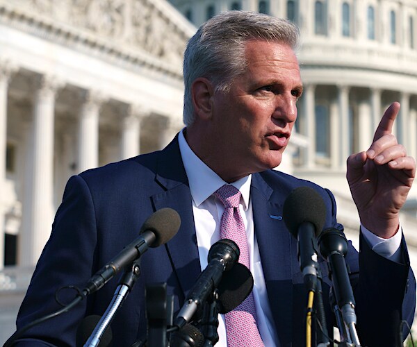 kevin mccarthy points and speaks during a news conference