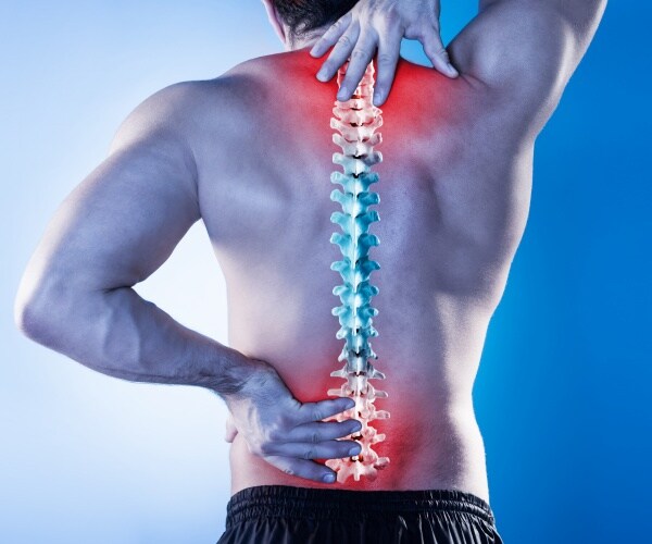 man with back pain, illustration of the spine in his back with red showing where the pain is