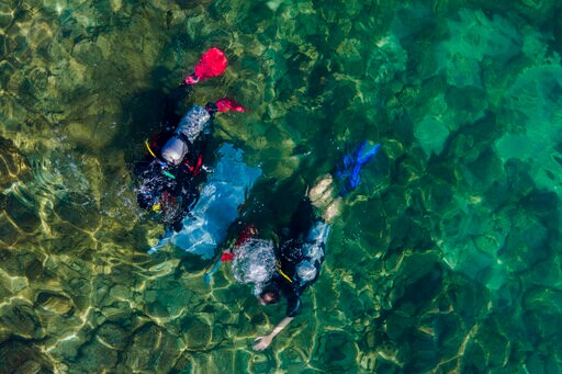 Israeli Divers Haul Trash from Ancient site for Oceans Day