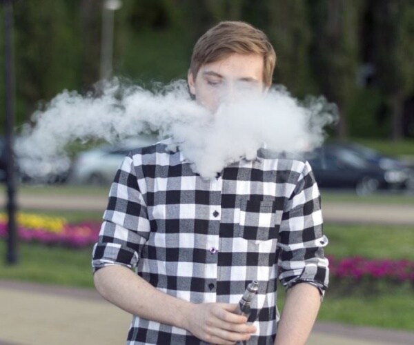 young man vaping