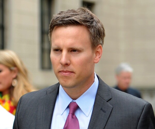 bill stepien in a gray suit and purple tie