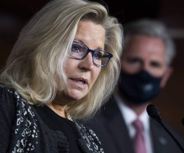 liz cheney with kevin mccarthy in the background