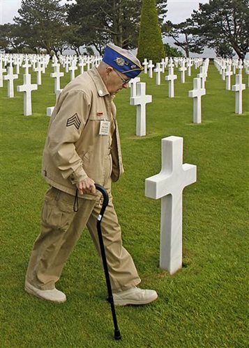 Veteran Scans the Graves of Friends