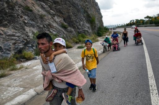 In Migrant Caravan, Kids and Parents Struggle with long Trek