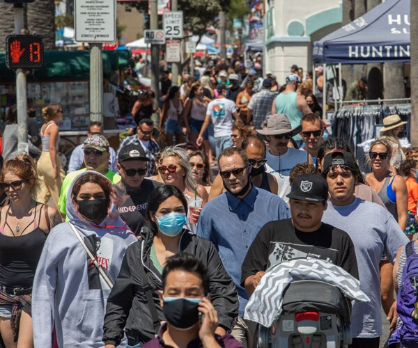 people cross the street at huntington beach california
