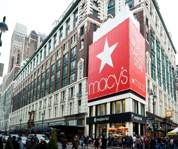 macys department store is shown with people walking by