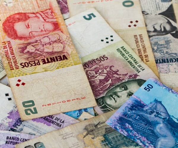 colorful background of mixed banknotes of south and central american currencies