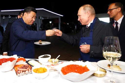 Putin Treats China's Leader to Pancakes, Vodka at Forum