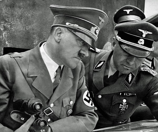 a 1939 photo shows german nazi chancellor and dictator adolf hitler examining a geographical survey map