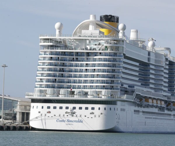 The Costa Smeralda cruise ship is shown docked near rome.