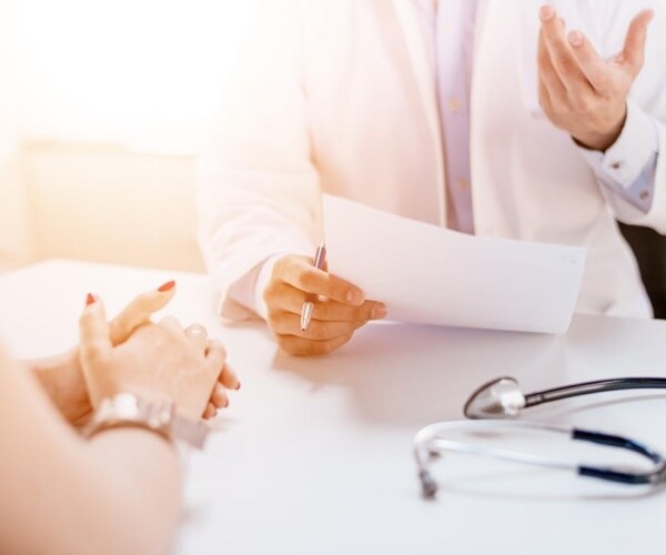 doctor giving medical advice to a patient