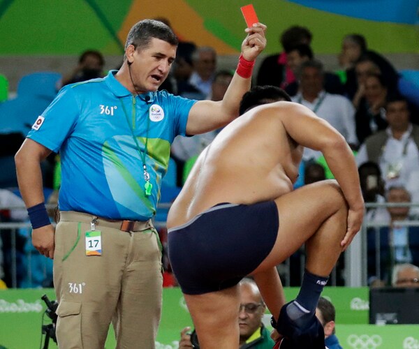 Mongolian Wrestling Coaches Strip to Protest Medal Decision