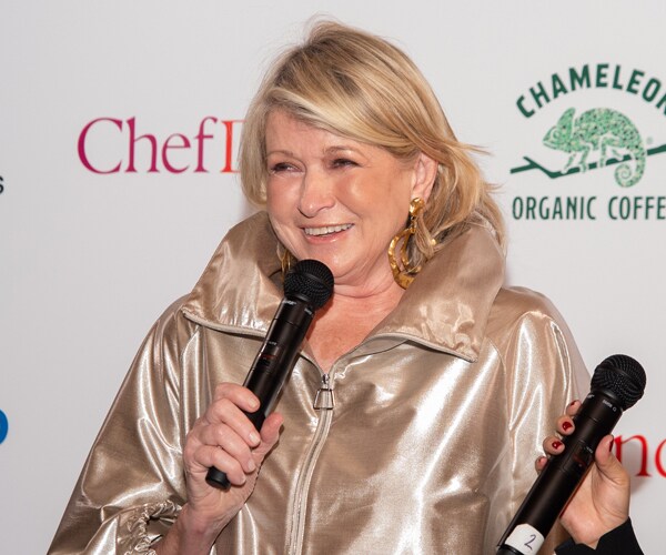 martha stewart holding a microphone and speaking