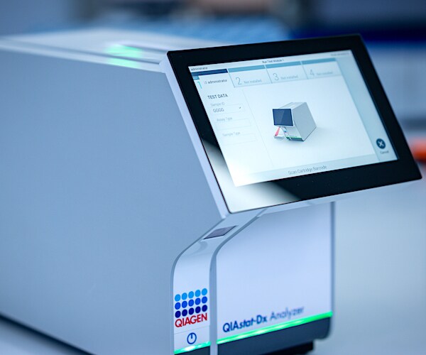 the Qiagen QIAstat-Dx testing device for infectious diseases sits on a table