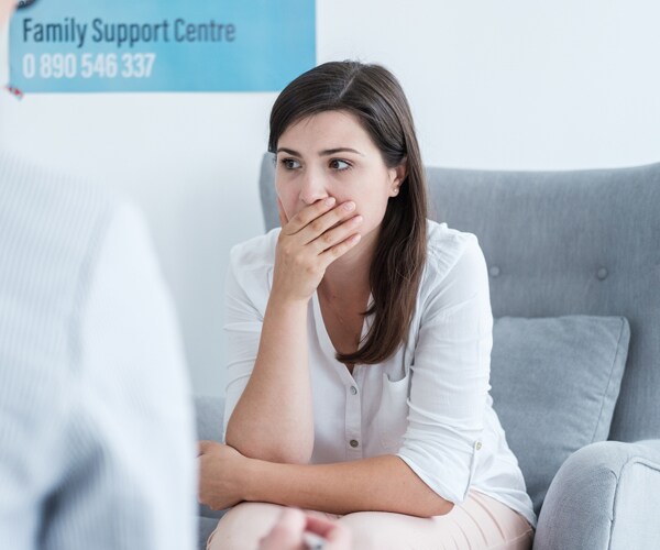 a female patient reacting to bad news