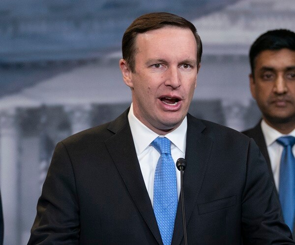 chris murphy speaks at a briefing with other democrats