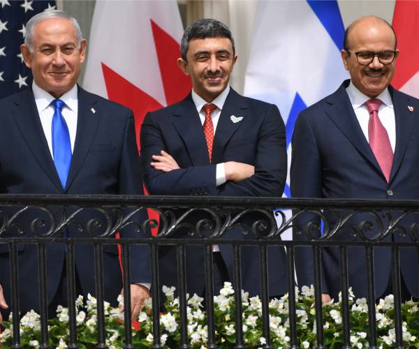 the three men stand outside the white house