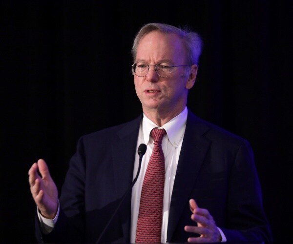 schmidt in a suit and red tie