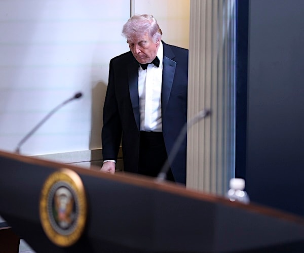 Donald Trump arrives at a briefing