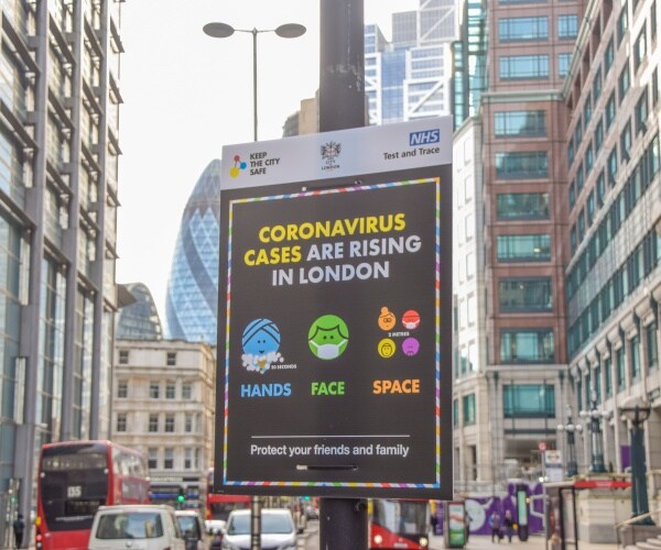 Sign in London says COVID cases are rising and how to protect yourself