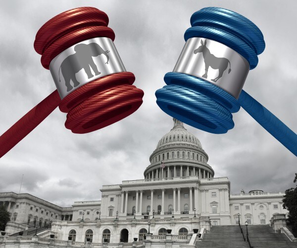 two gavels with republican and democratic logos on them with the united states capitol in the background