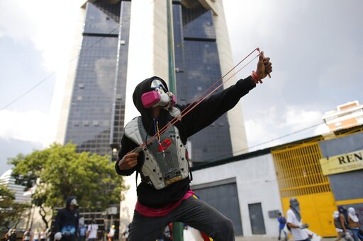 The Latest: Battle of Political Kids Appears in Venezuela
