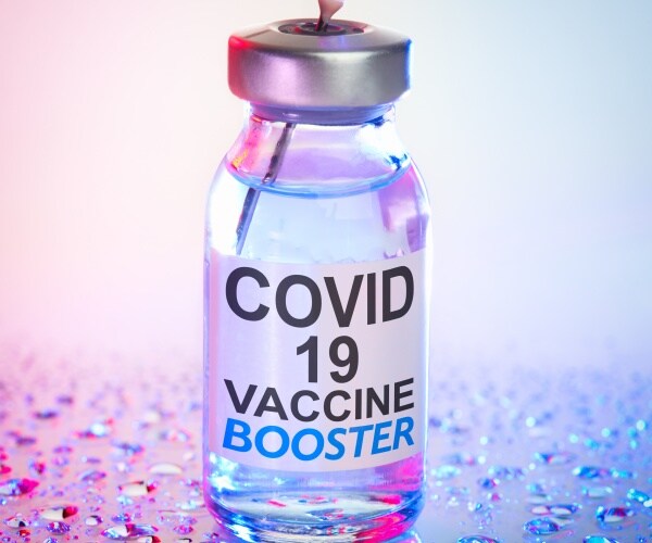 vial labeled COVID-19 Booster Shot
