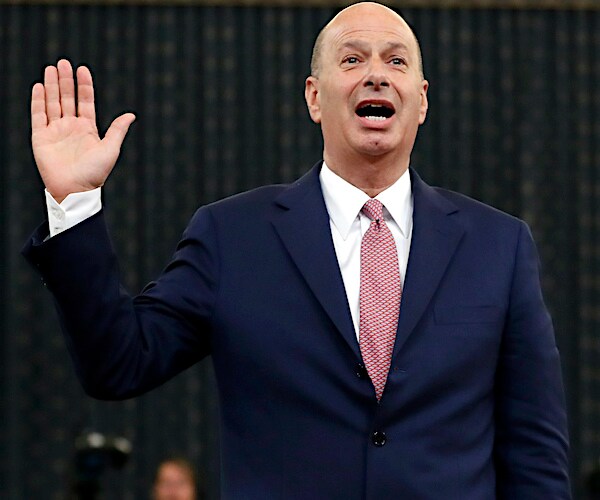 gordon sondland raises his right hand to take his oath before the house intelligence committee
