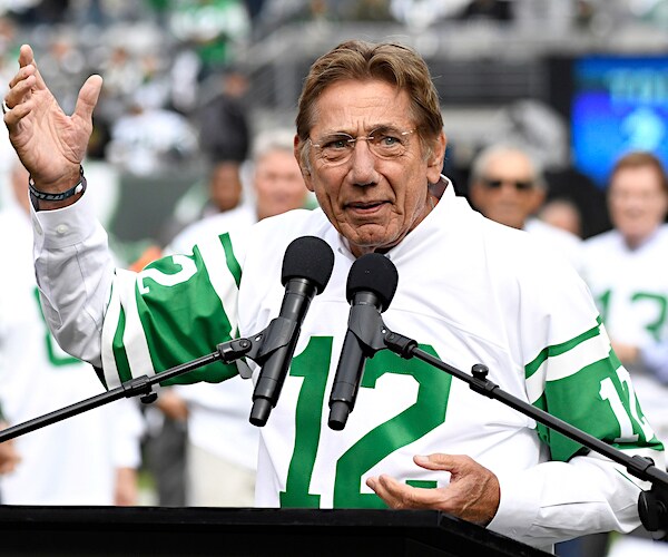 joe namath wearing a throwback jets jersey delivers a halftime speech to jets fans