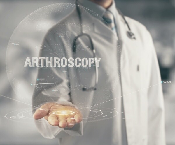 doctor touching screen with 'arthroscopy' written on it