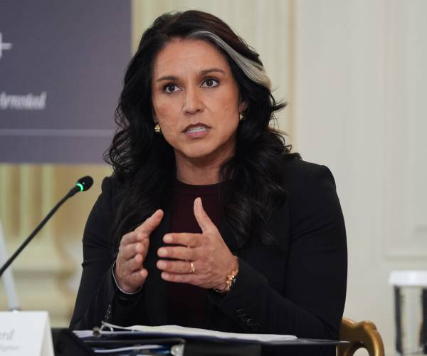 Sen. Warner Wants Gabbard to Testify About Her Presence at FBI Raid