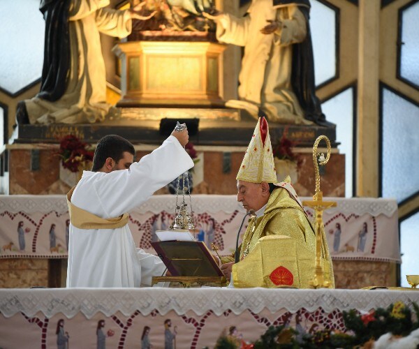 Syrian Christians Attend Mass Amid Christmas Tree Burning