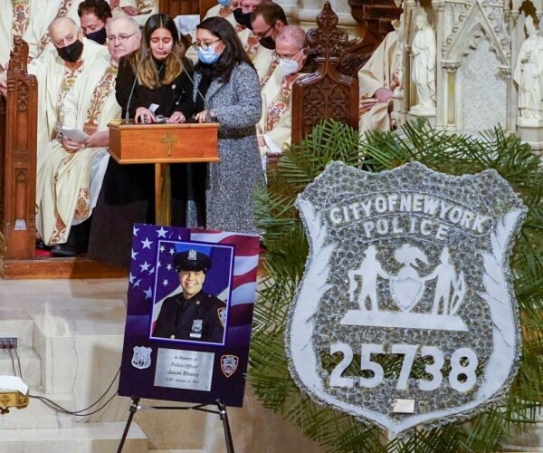 Slain nypd officer's widow calls out manhattan da in funeral eulogy