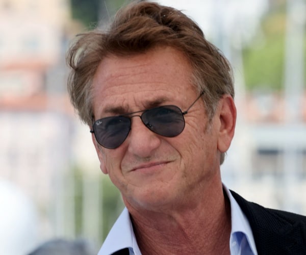 Sean penn says 'cowardly genes' cause men to wear skirts