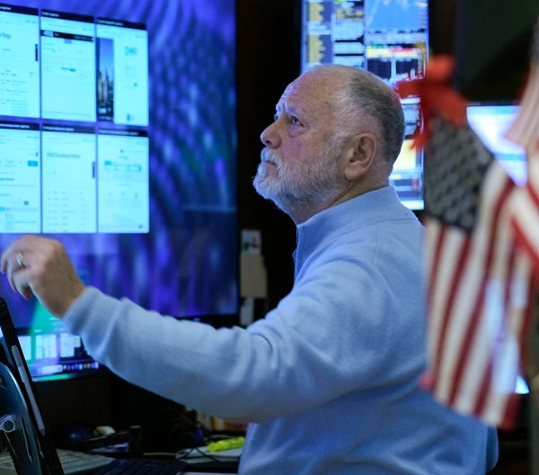 Wall Street Ends Down as Fed Holds Rates Steady